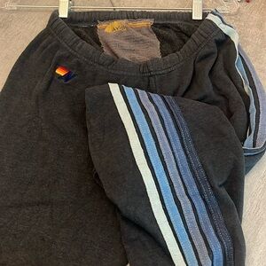 Aviator Nation cozy blue sweatpants with blue stripes down the side